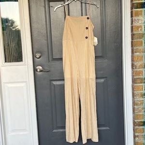 Altar’d State yellow and white striped sleeveless jumpsuit Orig $80.  Like new